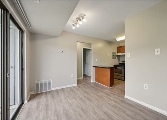 an empty living room and kitchen at ReNew Odenton