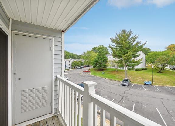 the view from the balcony of a residence with a door at ReNew Odenton