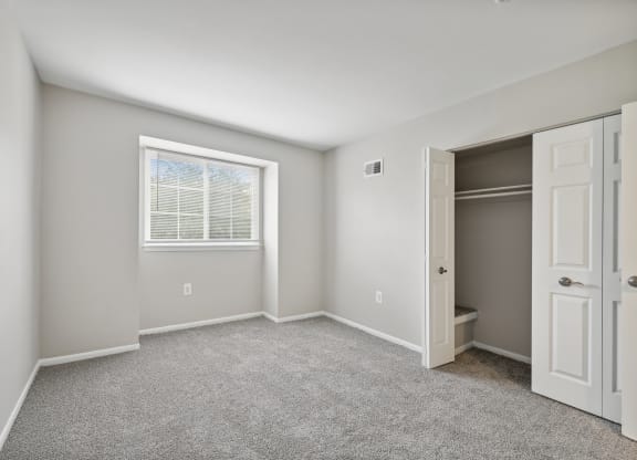 an empty bedroom with a closet at ReNew Odenton
