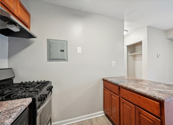 a kitchen with granite counter tops and a stove and a refrigerator at ReNew Odenton