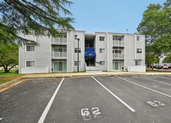 ReNew Odenton apartment building with a parking lot and stairs