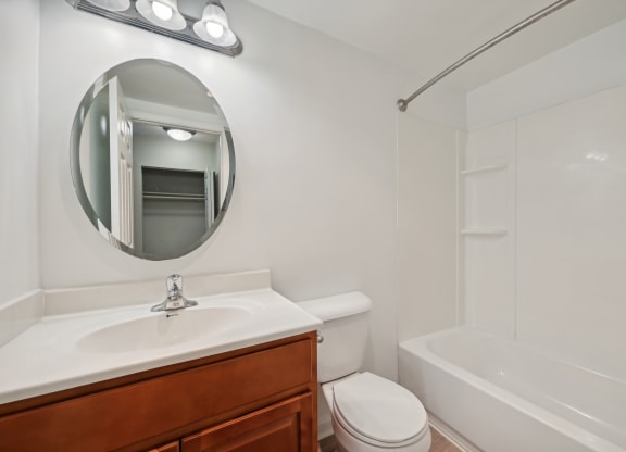 a bathroom with a sink toilet and a bath tub at ReNew Odenton