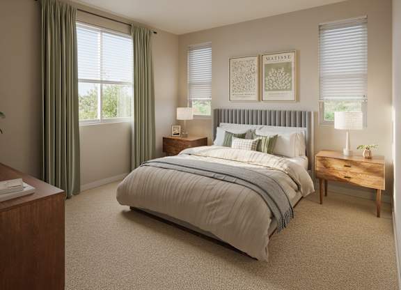 A bedroom with a large bed, a nightstand, and a window with curtains.