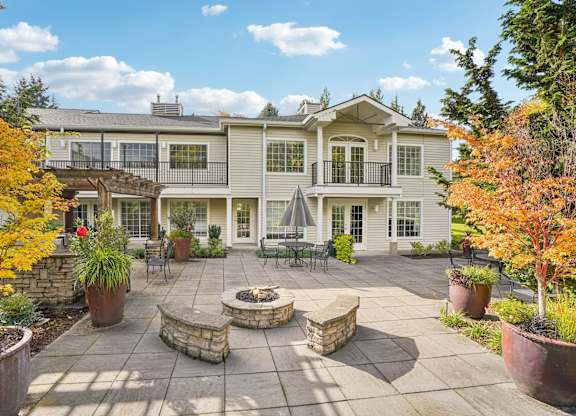 An apartment courtyard with a patio and a fire pit.