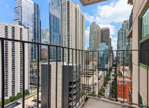 a balcony with a view of the city and skyscrapers