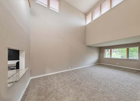 A spacious room with a large window and high ceilings at Oak Park City, Oak Park, 60301