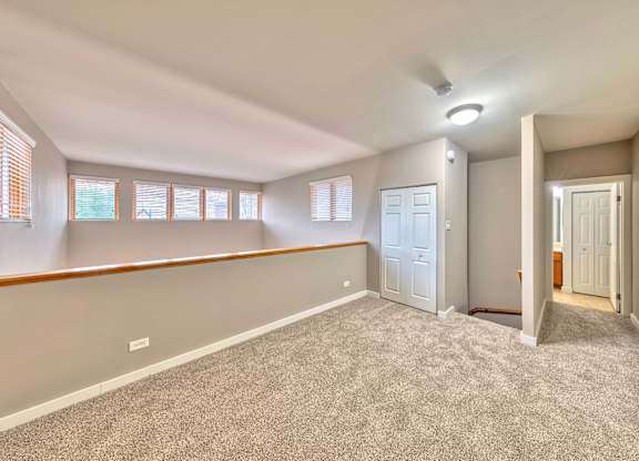 A room with a carpeted floor and a door on the right side. at Oak Park City, Illinois, 60301
