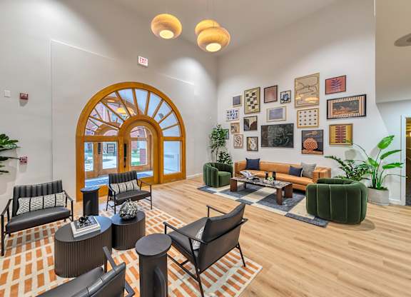 Lobby with chairs, pictures and high ceilings at Oak Park City, Oak Park, 60301