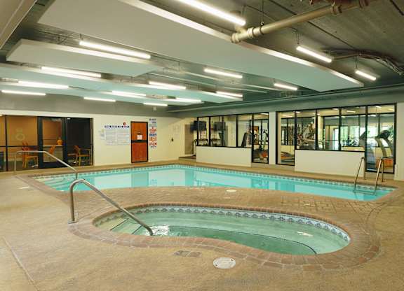 A small indoor pool with a hot tub at Astor Place of Edina Apartments , Edina, MN