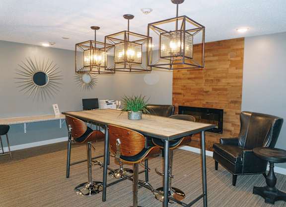 A conference room with a wooden table and chairs at Astor Place of Edina Apartments , Edina, MN