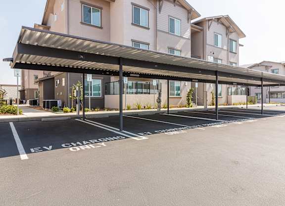 A parking lot with carports.