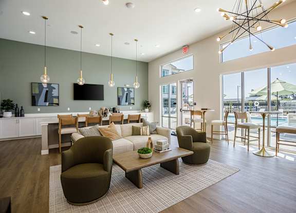 Interior of the lobby at Arrive Vacaville with a pool in the background