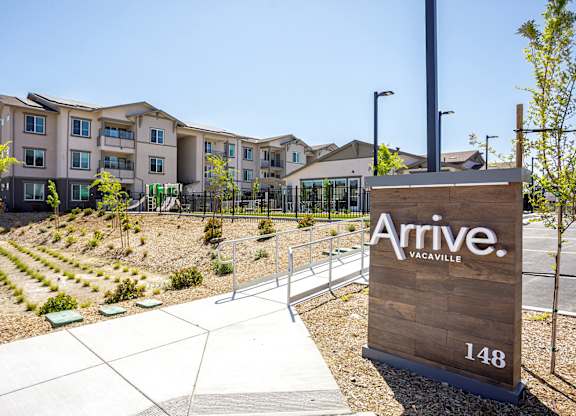 Monument sign with Arrive Vacaville in the background