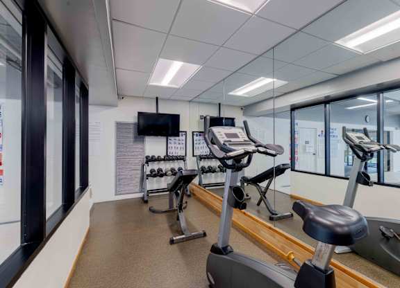 A gym with treadmills and exercise bikes.