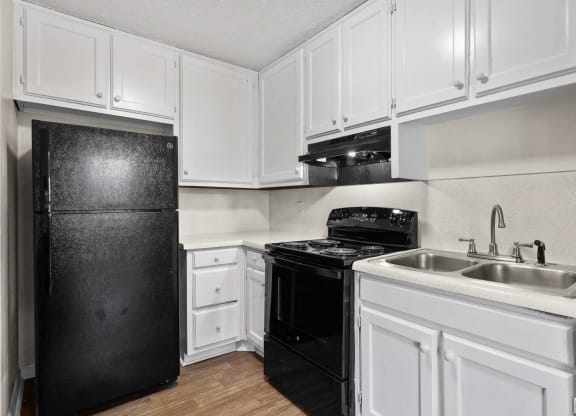 a kitchen with white cabinets at Alcovy Terrace, Georgia, 30014