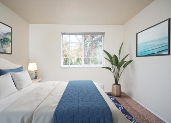 a bedroom with a large bed and a window at Sundial Apartments, Oregon, 97070
