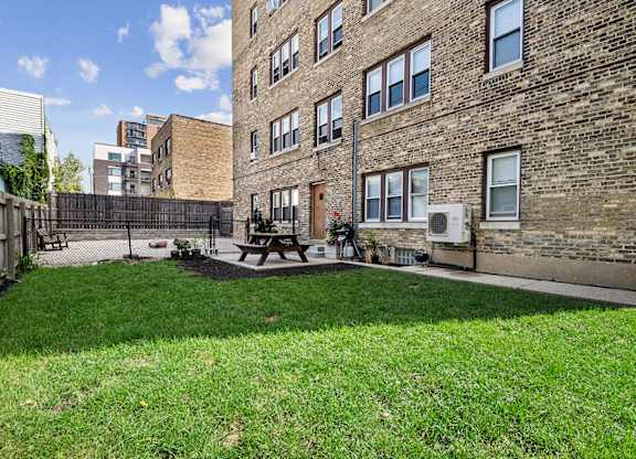the yard of Cambridge manor with picnic area and dog park