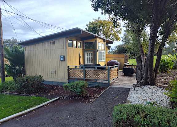 Cabin with a porch and driveway at Salinas Sunset Apartments, Salinas, CA, 93907