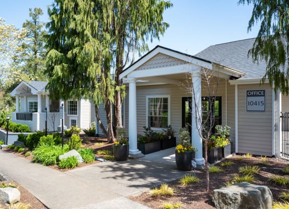 a house with a porch and a sign that reads office 105 at Murrayhill Park, Beaverton