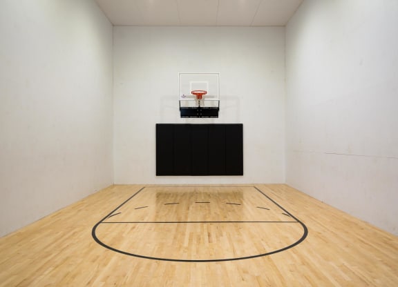 a large room with a basketball court and a scoreboard on the wall at Murrayhill Park, Oregon, 97008