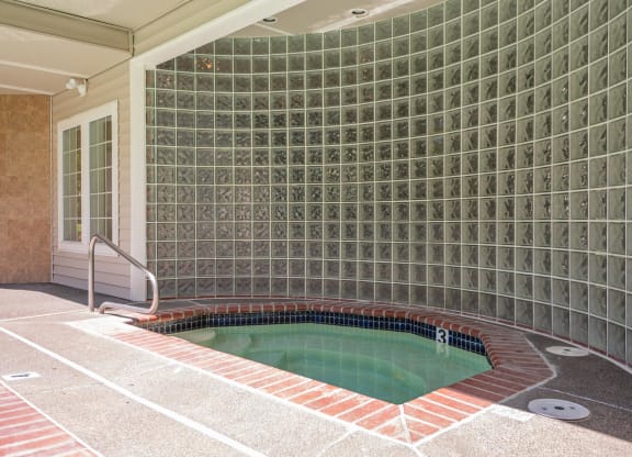 a jacuzzi tub in a bathroom with tile walls at Murrayhill Park, Beaverton, OR 97008