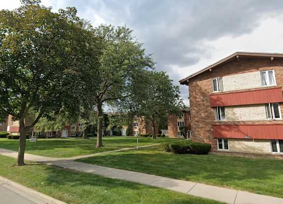 Brick building exterior with grassy areas and walkways at The Countryside, Countryside Illinois ?