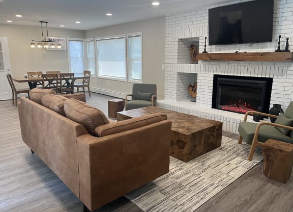 Clubhouse with a fireplace and a television