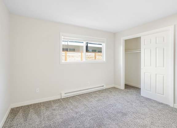 A room with a window and a door.