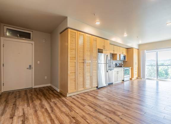 Open concept studio with kitchen and living area at Brooklyn Yard Apartments, Oregon