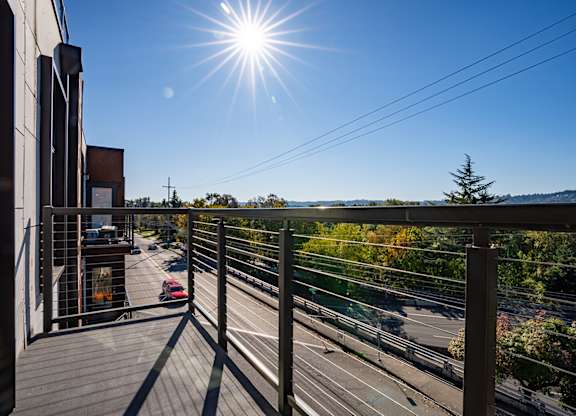 Rooftop terrace with panoramic city and hillside views at Brooklyn Yard Apartments, Portland, OR 97202