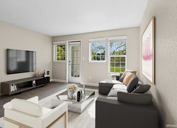 A living room with a grey couch, a white armchair, a coffee table, and a flat screen TV.