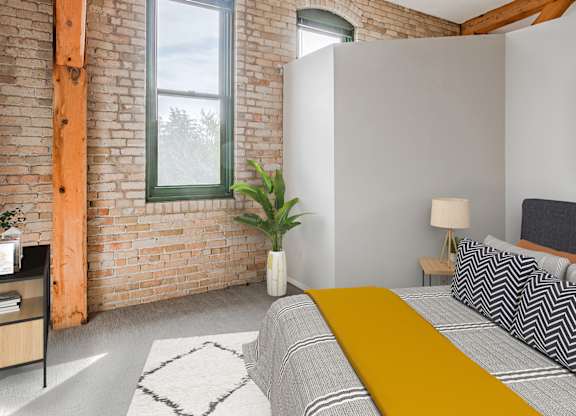 Bedroom with bed at FreightYard Townhomes and Flats, Minneapolis