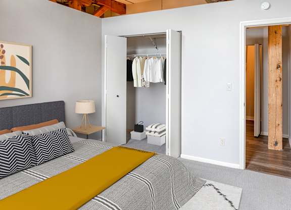 Bedroom with attached closet at FreightYard Townhomes and Flats, Minneapolis, MN