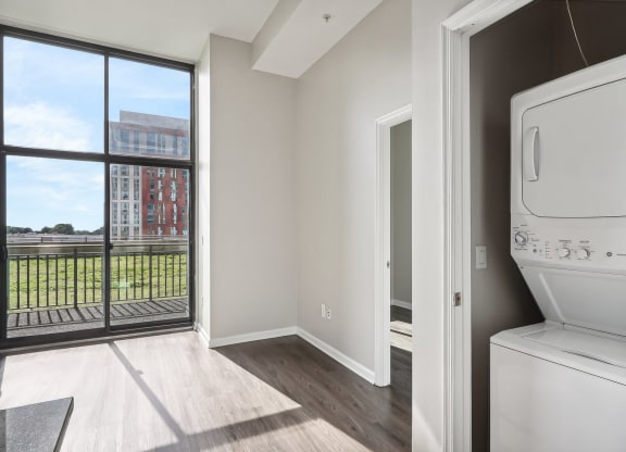 washer and dryer next to a window