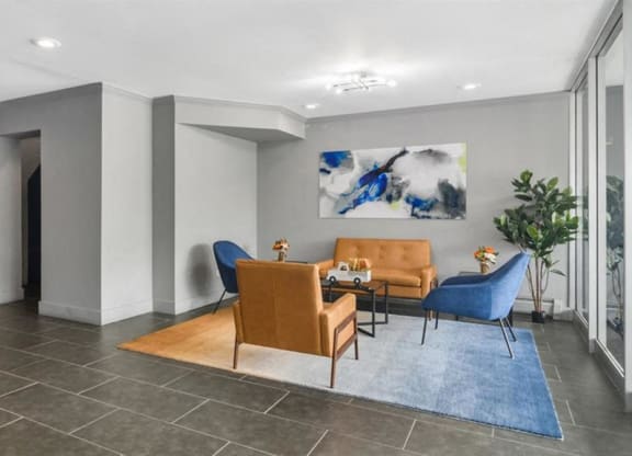 a living room with a couch and chairs and a table at ReNew Aurora, Aurora, 60506