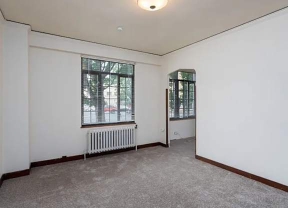 Living room with a window and a radiator at The Lafayette, Portland, OR, Oregon 
