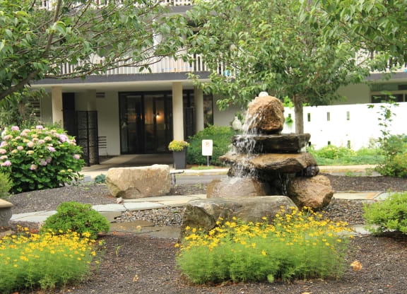 a fountain in a garden in front of a buildingat Renew Worcester, Massachusetts, 01602