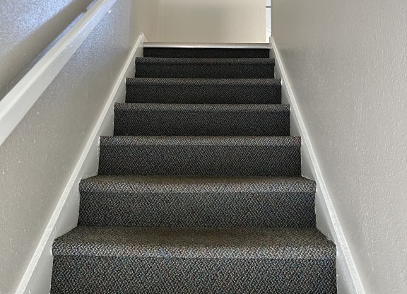 Staircase with carpeted stairs at Romig Court, Anchorage, AK