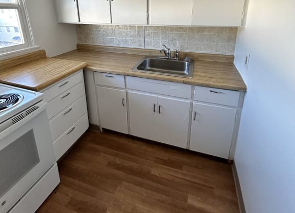 kitchen with white cabinets at Romig Court, Anchorage, AK