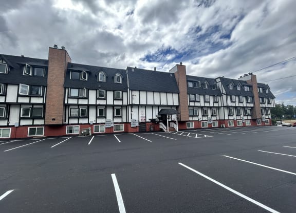 an empty parking lot in front of an apartment building at Kings Court, Alaska, 99501?
