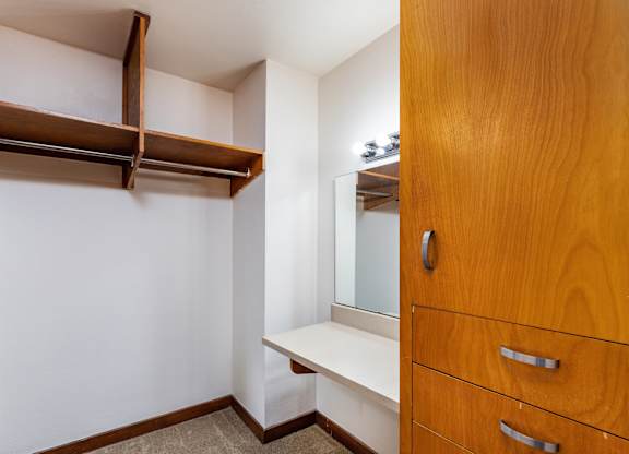 Wooden closet with a mirror and drawers at Julie Ann, Portland, OR, 97215
