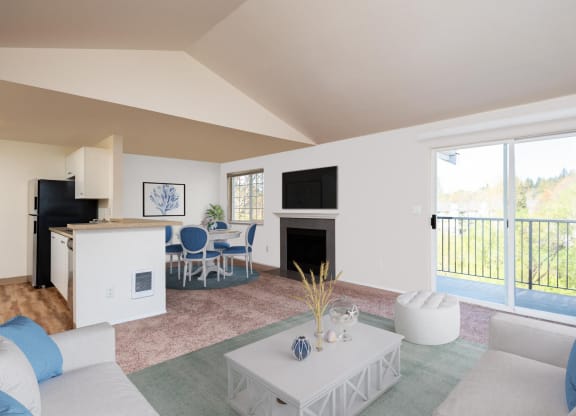 a living room with a couch and a table and a fireplace at Murrayhill Park, Beaverton, OR
