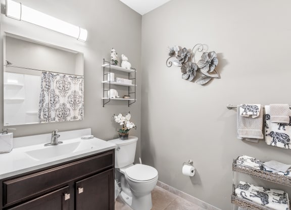 a bathroom with a sink toilet and a mirror at Lofts at 335, Connecticut