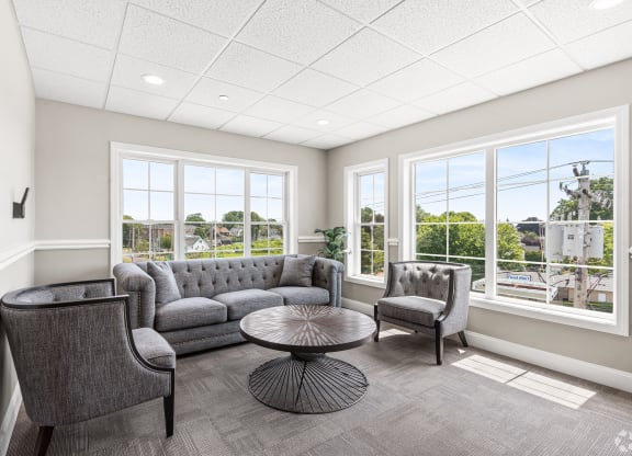 sitting room with couches and chairs and large windows at Lofts at 335, Stratford, CT