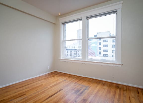 apartment interior with hardwood floors and city views at Maurice Dear Apartments, Portland, OR 97205