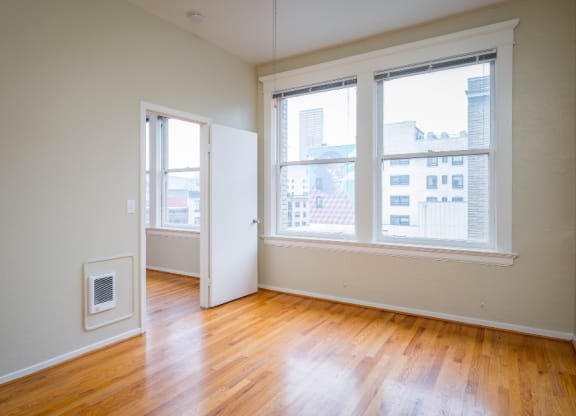 apartment interior with hardwood floors and city views at Maurice Dear Apartments, Portland