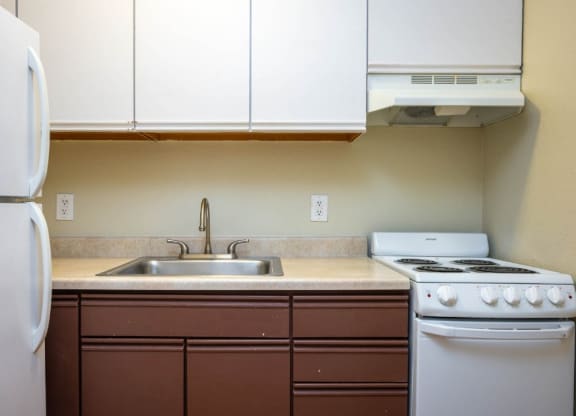Kitchen interior view at Maurice Dear Apartments, Portland, 97205