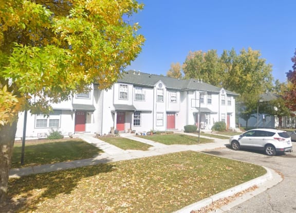 a car parked in front of a building  at Mason Street Townhomes, Grand Rapids, Michigan