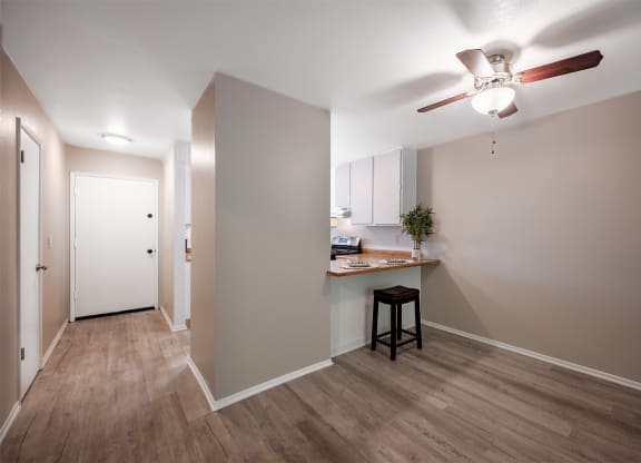 living room and kitchen with ceiling fan at Oak Park Apartments, Solvang, 93463