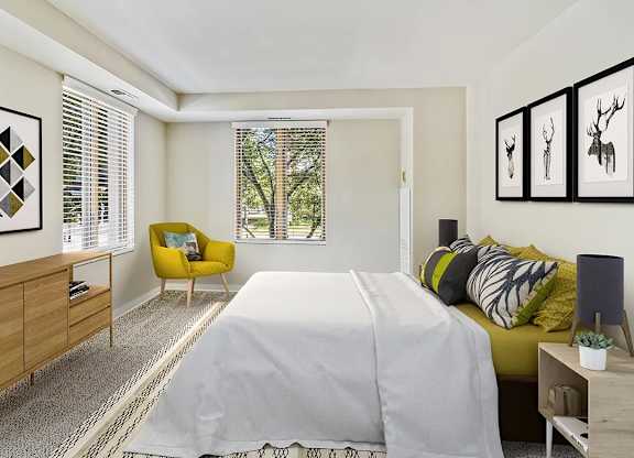 A bedroom with a large bed, a yellow chair, and a wooden dresser. at Oak Park City, Oak Park, IL 60301
